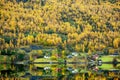 The leaves turn yellow all the mountains reflecting the beautiful water at the city of flam, Norway Royalty Free Stock Photo