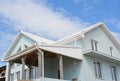 House with white roof tiles for energy saving. White roof bring cool savings and can reduce air conditioning