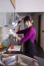 House wife stabbing an onion Royalty Free Stock Photo