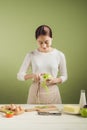 House wife wearing apron making. Steps of making cooking apple c