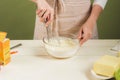 House wife wearing apron making. Steps of making cooking chocolate cake. Preparing dough, mixing ingredients Royalty Free Stock Photo