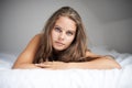 House, woman portrait and bed with sleeping, rest and relax in a bedroom with face and calm. Dreaming, female person and