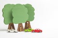 House of wooden blocks, wooden figures of trees, euro money, mod