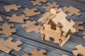 house of wooden pieces of puzzles. creative idea, business concept, construction, sale, mortgage, credit. Royalty Free Stock Photo