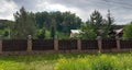 A house in the woods behind  in the grass Royalty Free Stock Photo