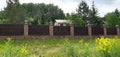 A house in the woods behind  in the grass Royalty Free Stock Photo