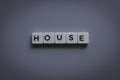 House word made of square letter word on gray background