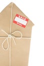 House Wrapped In Brown Paper With Sale Sticker
