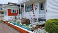 House yard with an array of rocks and a wooden crab trap.