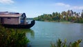 A houseboat is anchored in a lake at the Kerala Backwaters in India. Houseboat on Kerala backwaters Royalty Free Stock Photo