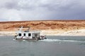 Houseboat floating in Lake Powell Royalty Free Stock Photo