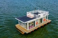 A houseboat on a lake in the city, a place of snouth and entertainment