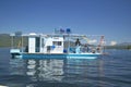 Houseboat on Lake McCall, Idaho in summer with people relaxing on boat Royalty Free Stock Photo