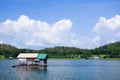 Houseboat, lake, moutain and sky in Thailand Royalty Free Stock Photo