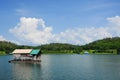 Houseboat, lake, moutain and sky in Thailand Royalty Free Stock Photo