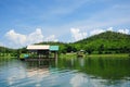 Houseboat, lake, moutain and sky in Thailand Royalty Free Stock Photo