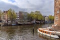 Houseboat and ship on the canal in Amsterdam Royalty Free Stock Photo