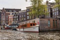 Houseboat with ship on the water in Amsterdam Royalty Free Stock Photo