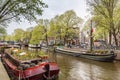 Houseboat and ship wiht flowers on the water in Amsterdam