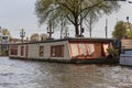 Houseboat at the sunset in Amsterdam Royalty Free Stock Photo