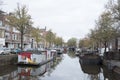 Houseboats in canal of the old city of groningen in the netherlands