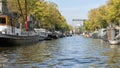 Houseboats lining a canal in Amsterdam, The Netherlands Royalty Free Stock Photo