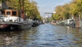 Houseboats lining a canal in Amsterdam, The Netherlands Royalty Free Stock Photo