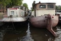 Houseboats moored on the Amstel River in Amsterdam, Netherlands. Royalty Free Stock Photo