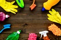 Housecleaner tools set with detergents, soap, cleaners and brush on wooden background top view mock up