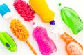 Housecleaning with detergents, soap, cleaners and brush in plastic bottles on white background top view mockup