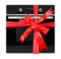 Household appliances. Black Oven gift tied red bow. Isolated