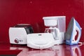 Household appliances in modern kitchen red background Royalty Free Stock Photo