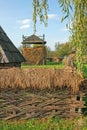 Household with braided twigs fence Royalty Free Stock Photo