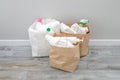 Household chemicals plastic bottles in a paper bag, recycling, and reuse concept