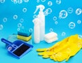 Household chemicals products and Supplies on Blue Background with bubbles. Cleaning Services Concept. Washing equipment Royalty Free Stock Photo