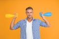 Household cleaning products kill coronavirus. Happy guy hold spray bottles. Using household cleaners and disinfectants Royalty Free Stock Photo