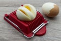 Household device for slicing eggs. Hard-boiled eggs slicer tool