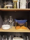 Household dishes on shelves of a household