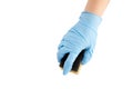 Household dishwashing sponge, hand in blue nitrile glove Royalty Free Stock Photo