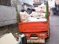 Household garbage truck. Sacks and black buckets filled with trash. Higyene environmental.