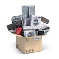 Household kitchen appliances in open cardboard box. Delivery, moving and online shopping concept Royalty Free Stock Photo