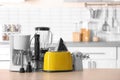 Household and kitchen appliances on table Royalty Free Stock Photo