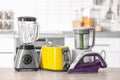 Household and kitchen appliances on table Royalty Free Stock Photo