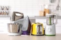 Household and kitchen appliances on table Royalty Free Stock Photo