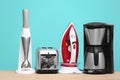 Household and kitchen appliances on table Royalty Free Stock Photo
