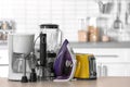 Household and kitchen appliances on table indoors Royalty Free Stock Photo