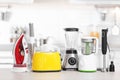 Household and kitchen appliances on table indoors Royalty Free Stock Photo