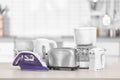 Household and kitchen appliances on table indoors Royalty Free Stock Photo