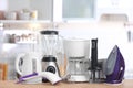 Household and kitchen appliances on table indoors Royalty Free Stock Photo