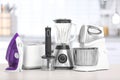 Different household and kitchen appliances on table indoors. Interior element Royalty Free Stock Photo